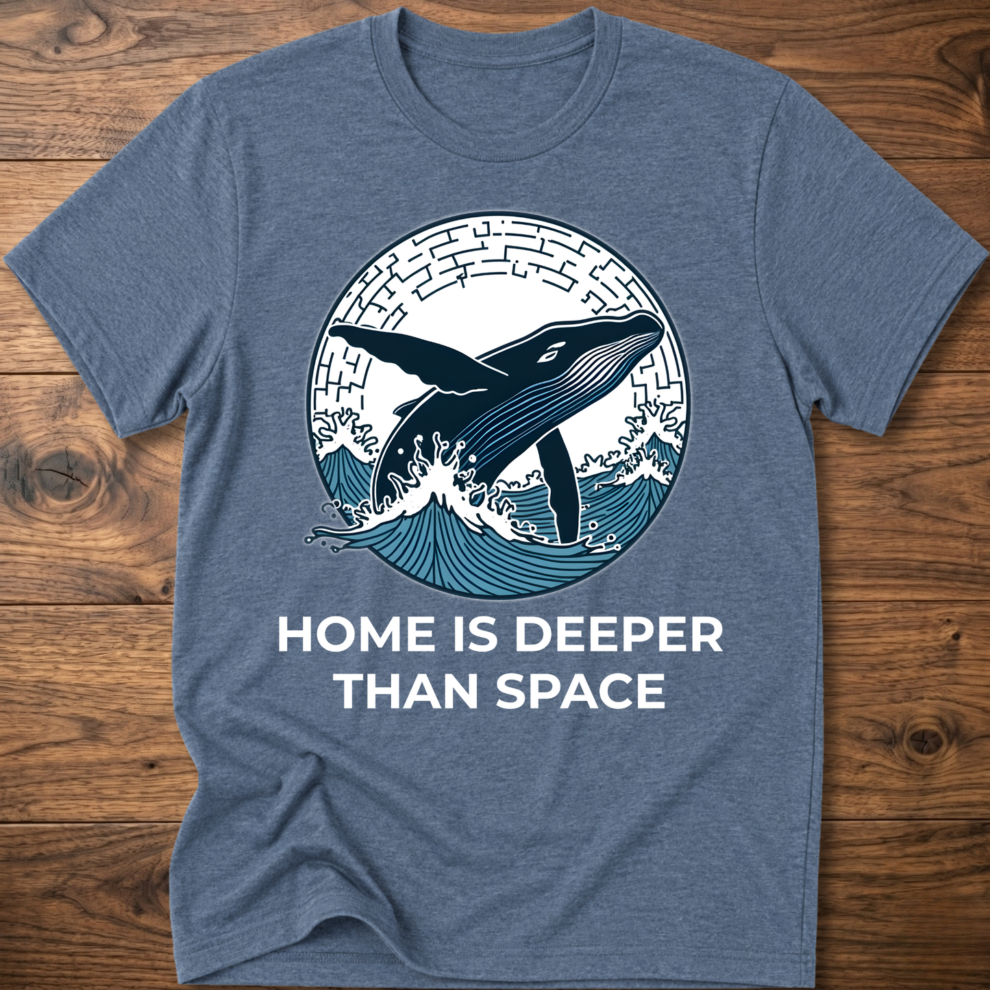 Heather blue T-shirt with whale surf graphic and “HOME IS DEEPER THAN SPACE” text