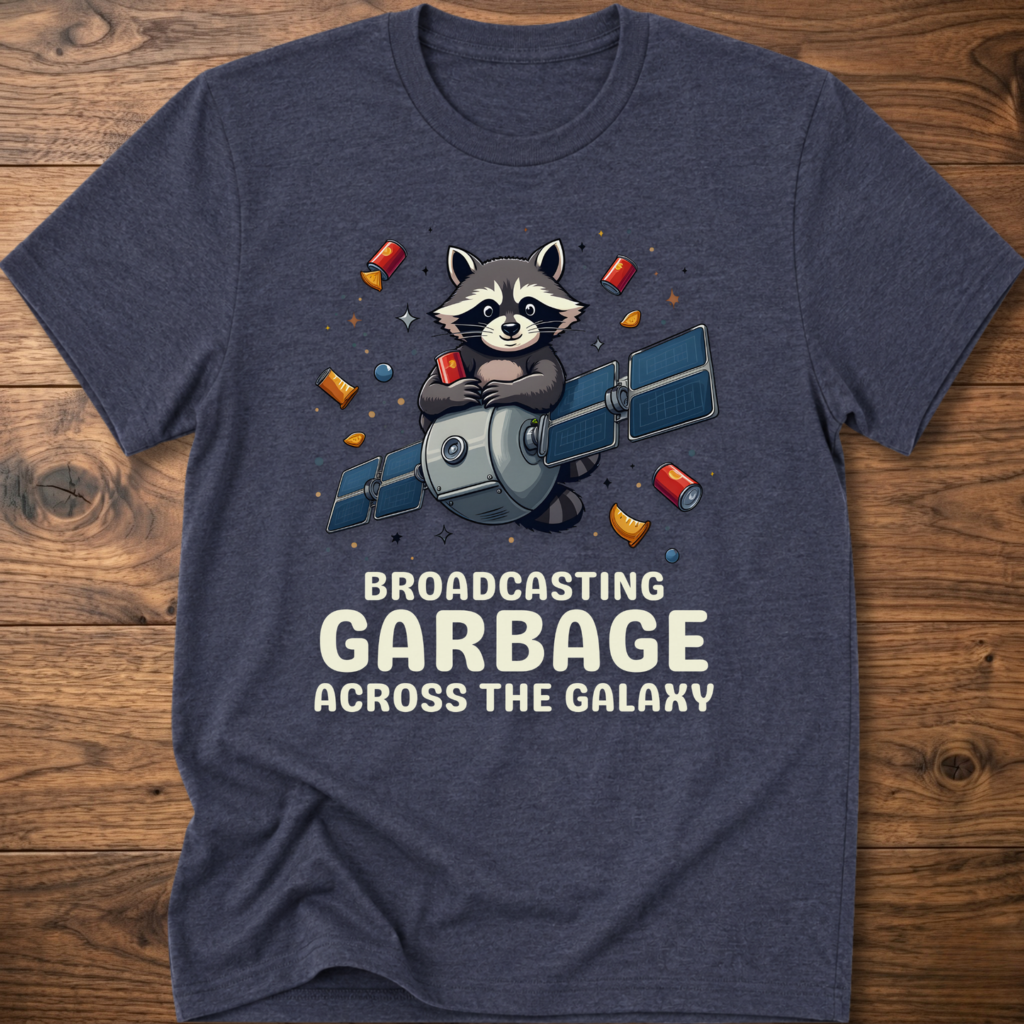 Dark heather gray crew-neck T-shirt with raccoon holding megaphone graphic and “Broadcasting Garbage” text.