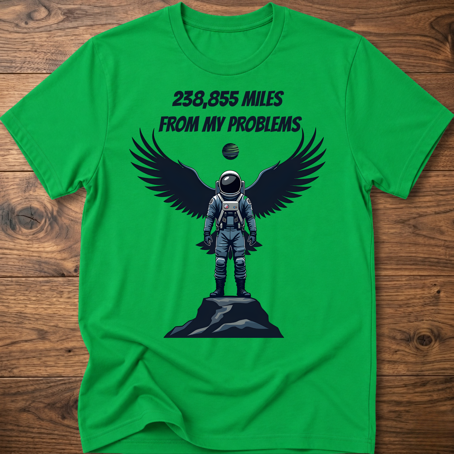 Green crewneck t-shirt with astronaut-eagle graphic and text '238,855 Miles'.