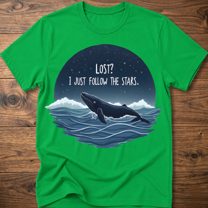 Green whale graphic t-shirt with circular “LOST? I JUST FOLLOW THE STARS.” print