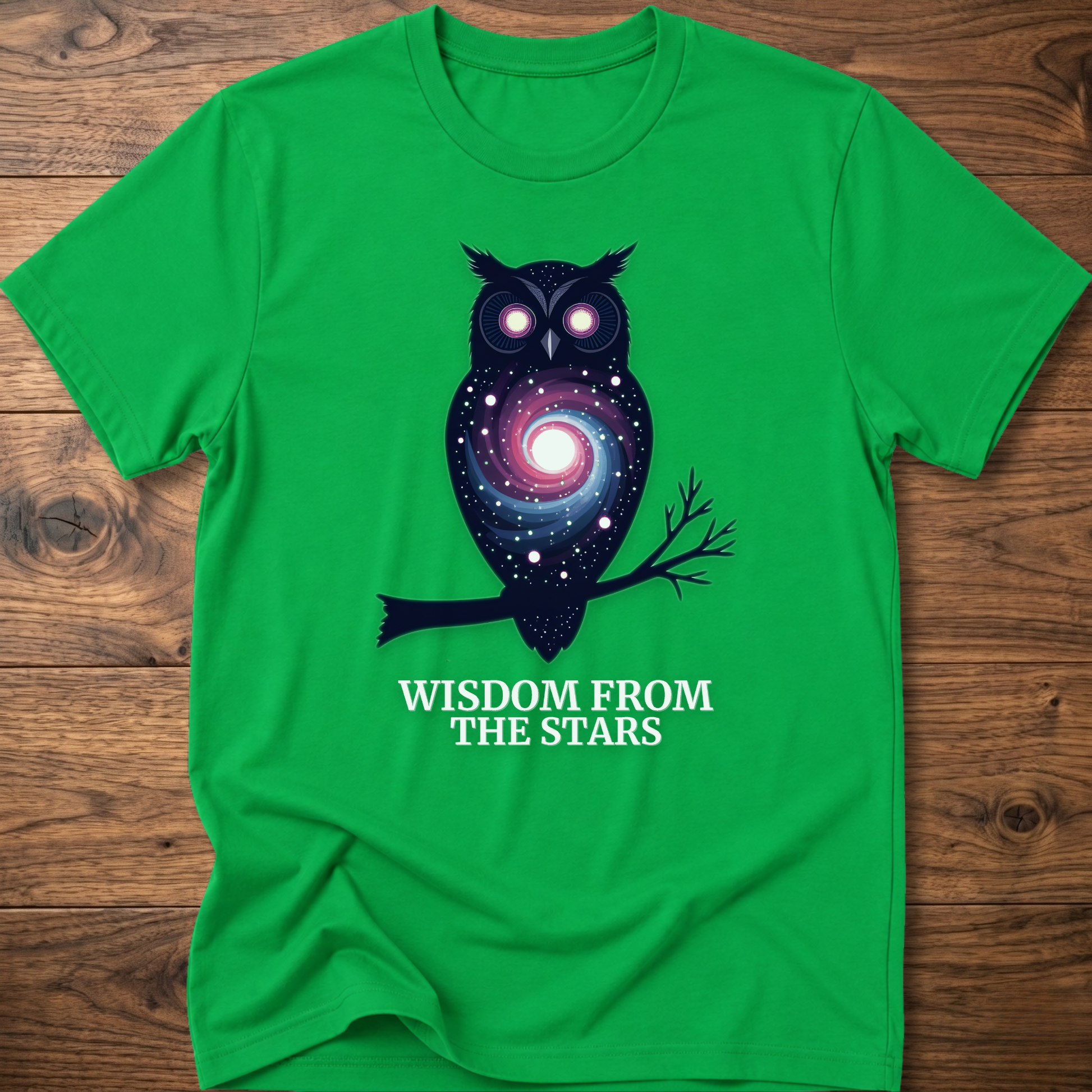 Green owl graphic t-shirt with glowing eyes and “Wisdom from the Stars” lettering