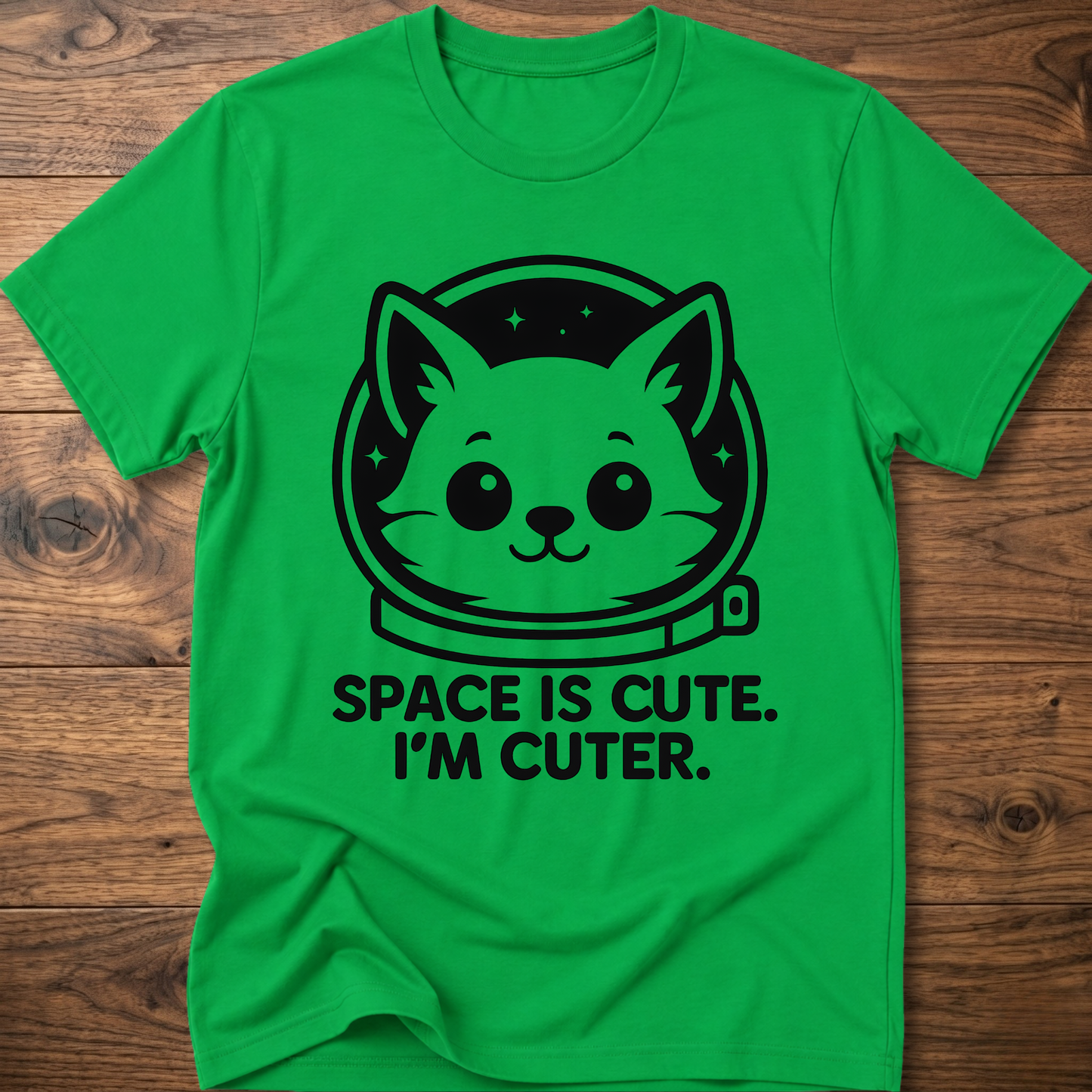 Green T-shirt with space cat face graphic and text "SPACE IS CUTE. I'M CUTER."