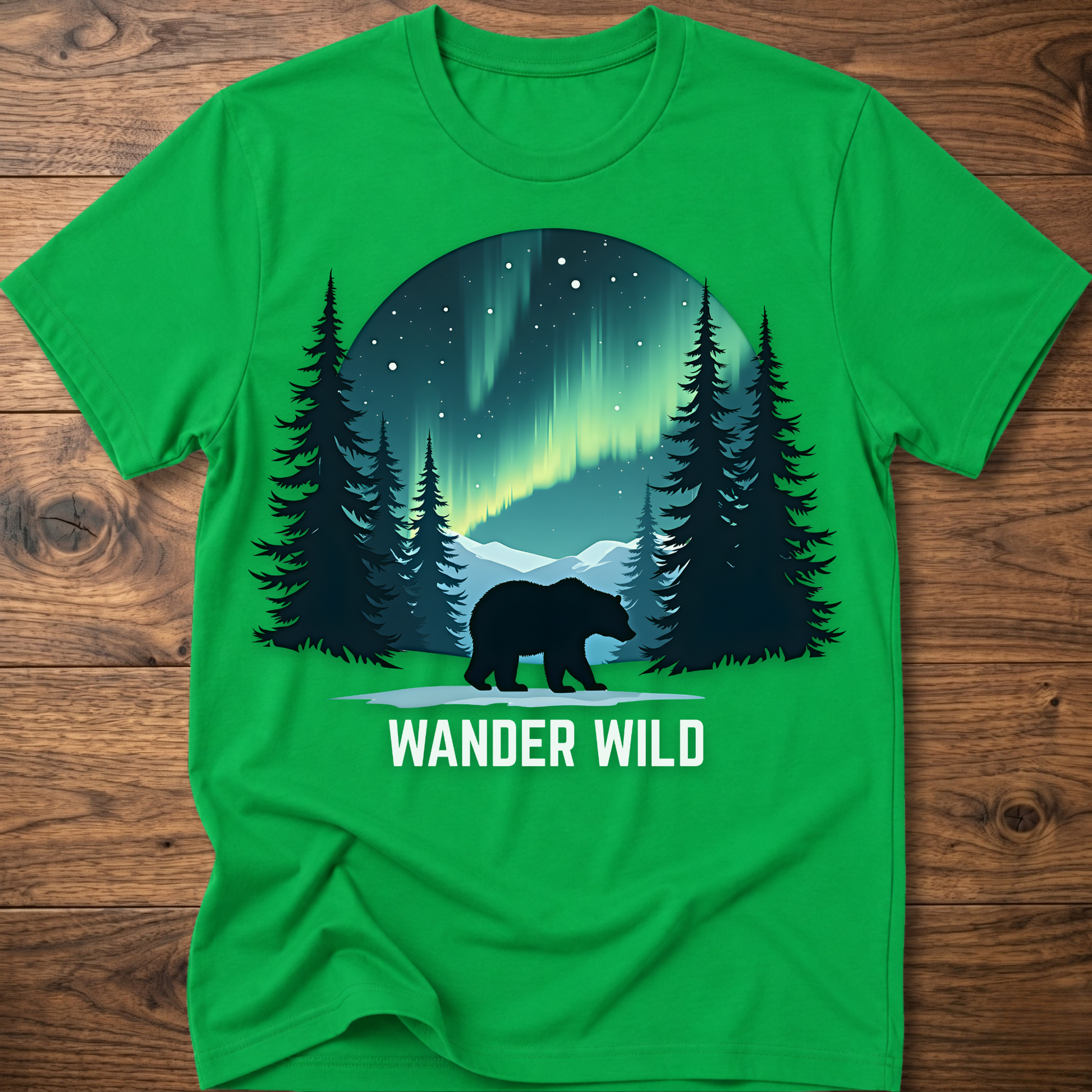 Green crew-neck t-shirt with bear in forest graphic and 'Wander Wild' text