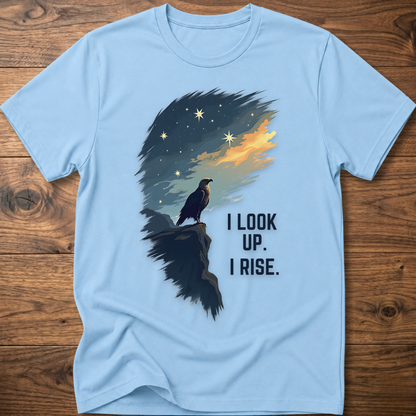 Light blue T-shirt with raven sunrise graphic and 'I LOOK UP. I RISE.'