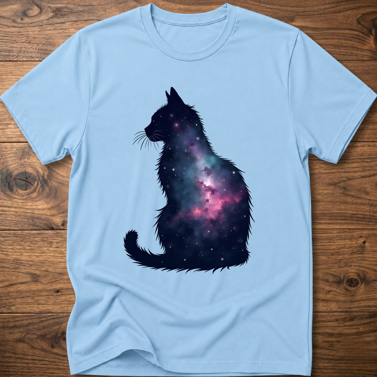 Light blue t-shirt with galaxy cat graphic on the front