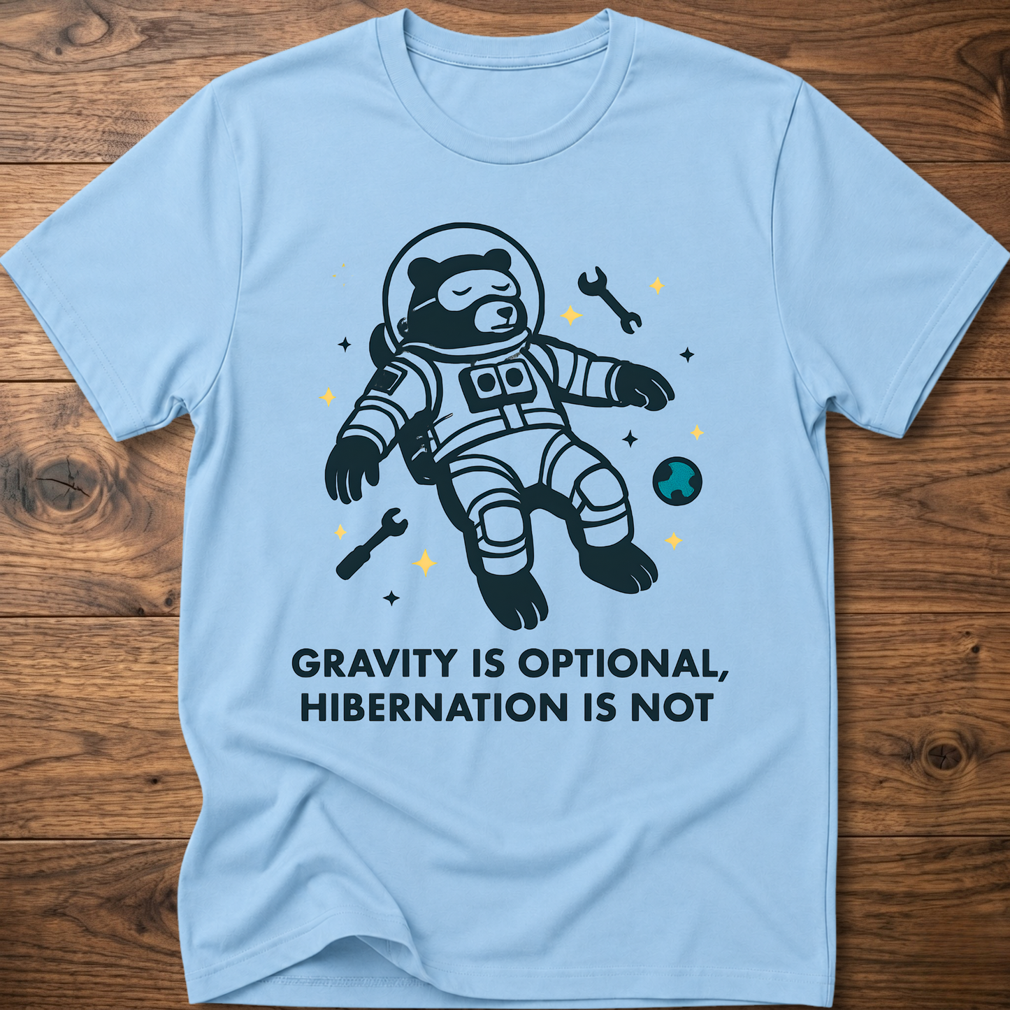 Hibernation bear astronaut t-shirt in light blue with front astronaut bear graphic and slogan text