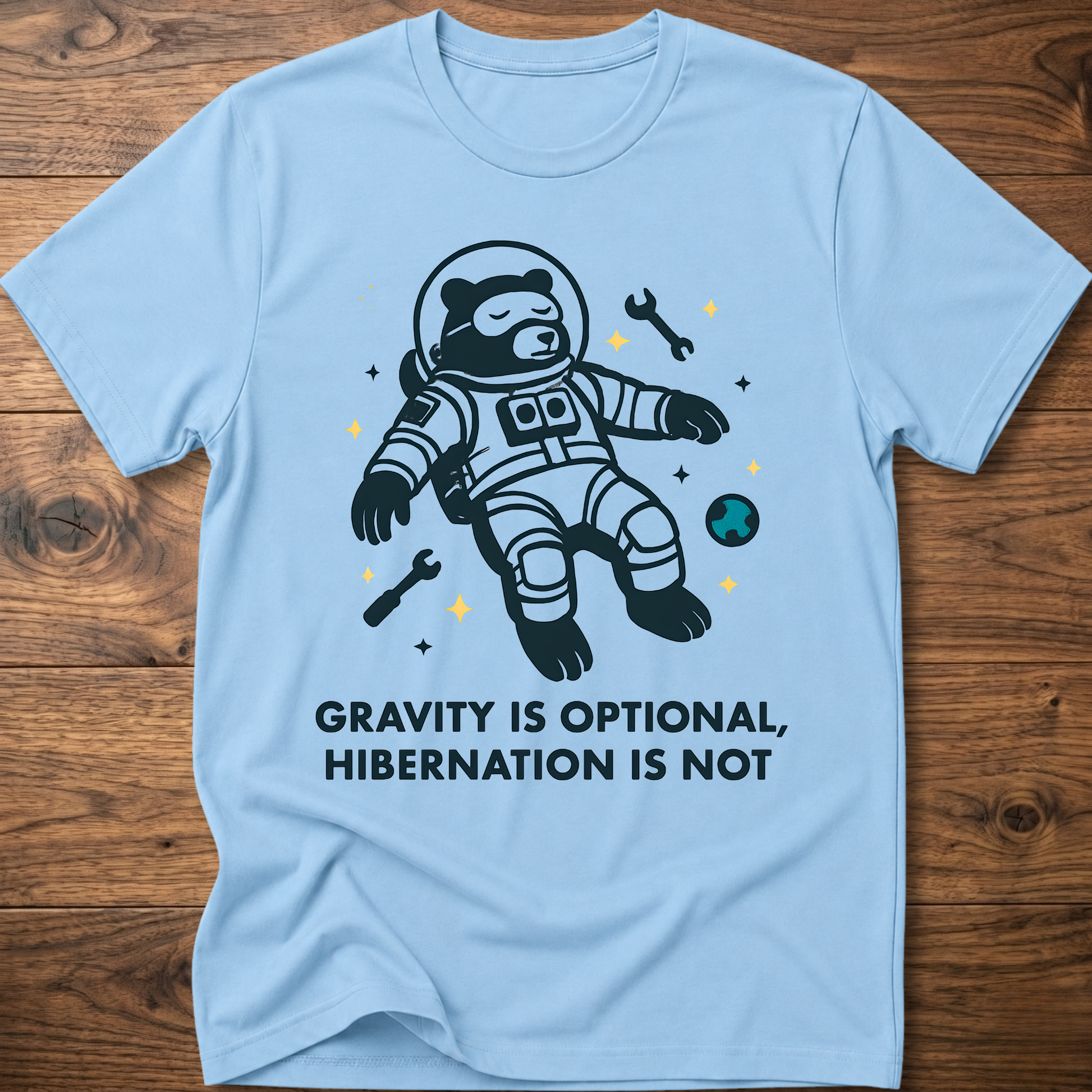 Hibernation bear astronaut t-shirt in light blue with front astronaut bear graphic and slogan text