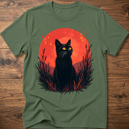 Olive green T-shirt with black cat graphic in red-orange halo and night-plant silhouettes