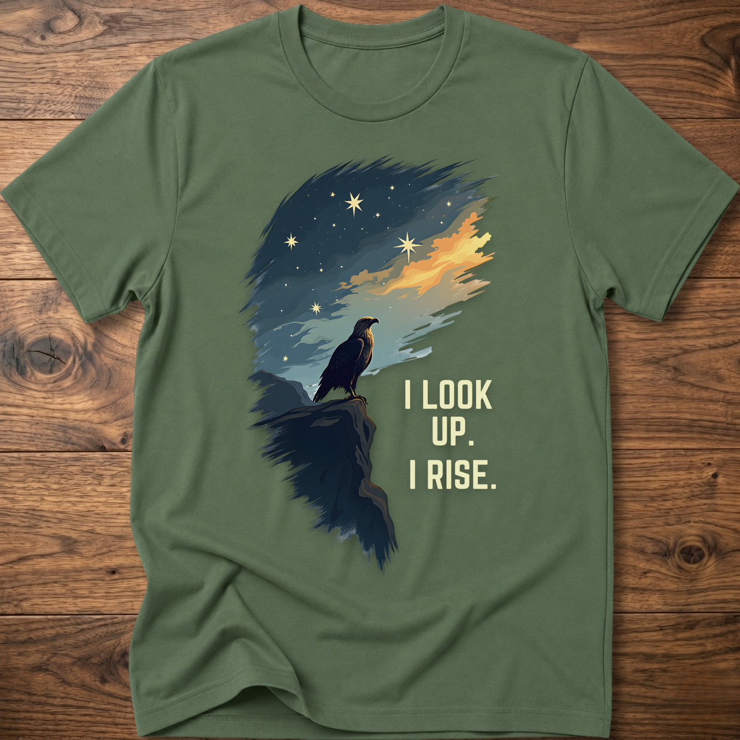 Olive green T-shirt with raven sunrise graphic and 'I LOOK UP. I RISE.'