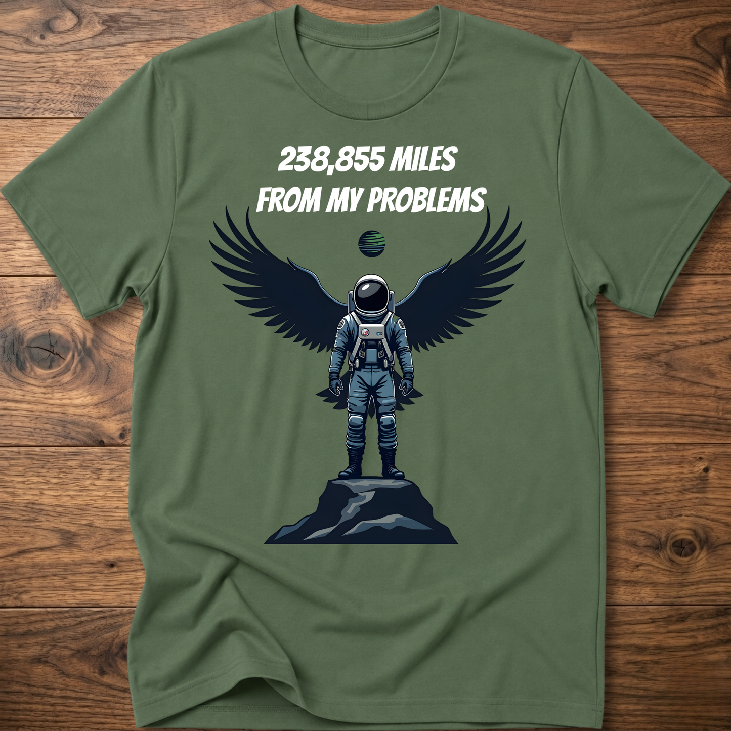 Olive green crewneck t-shirt with astronaut-eagle graphic and text '238,855 Miles'.