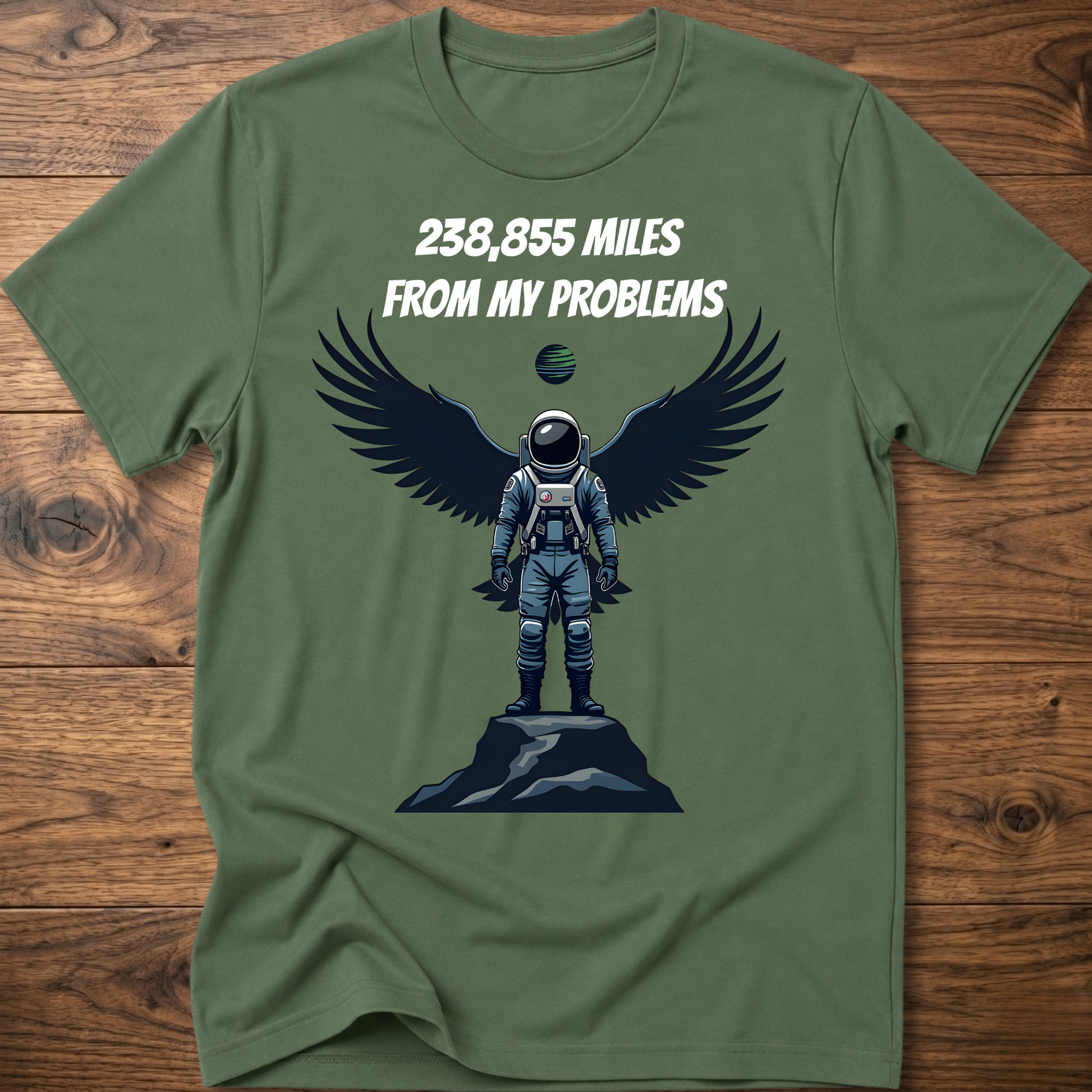 Olive green crewneck t-shirt with astronaut-eagle graphic and text '238,855 Miles'.