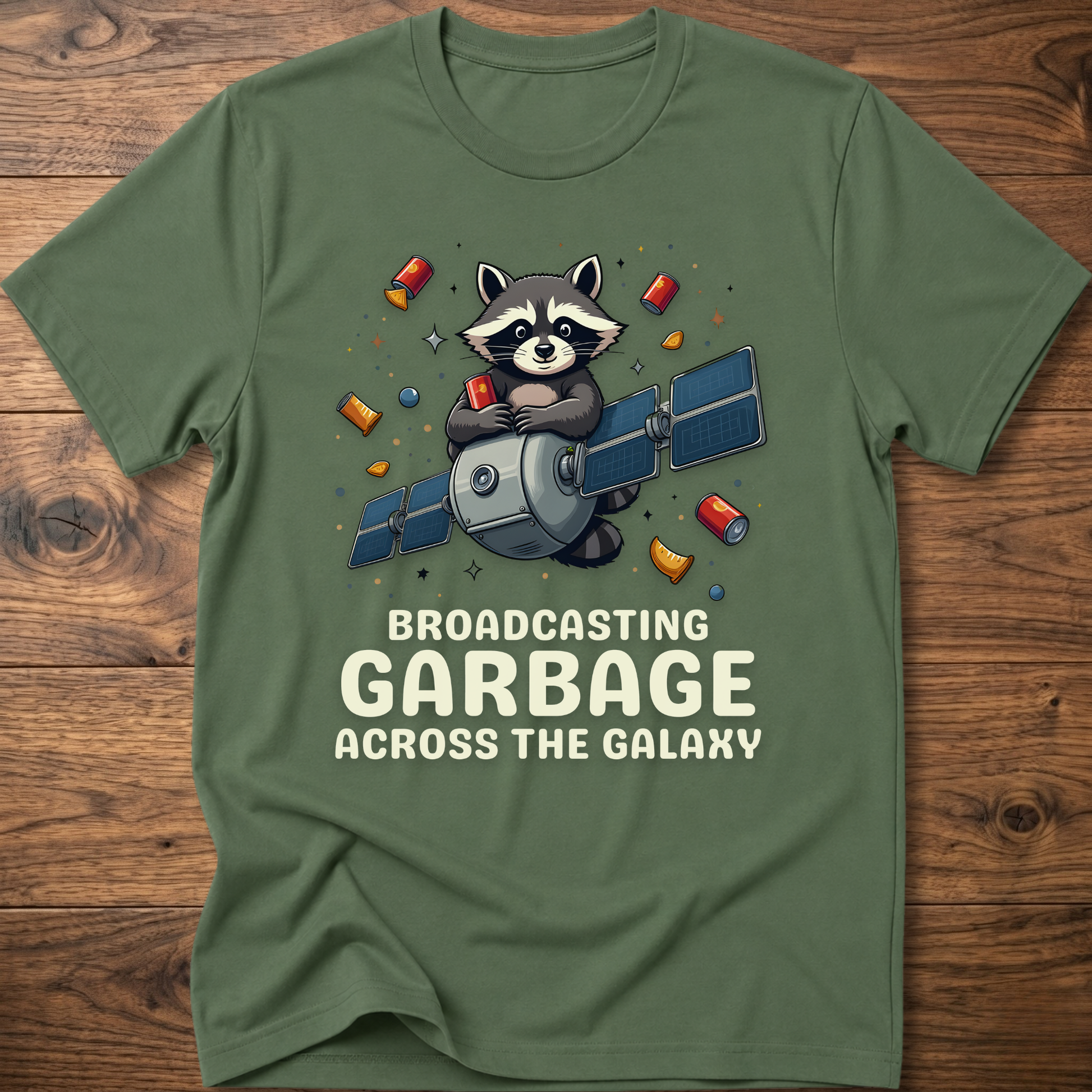 Olive green crew-neck T-shirt with raccoon holding megaphone graphic and “Broadcasting Garbage” text.