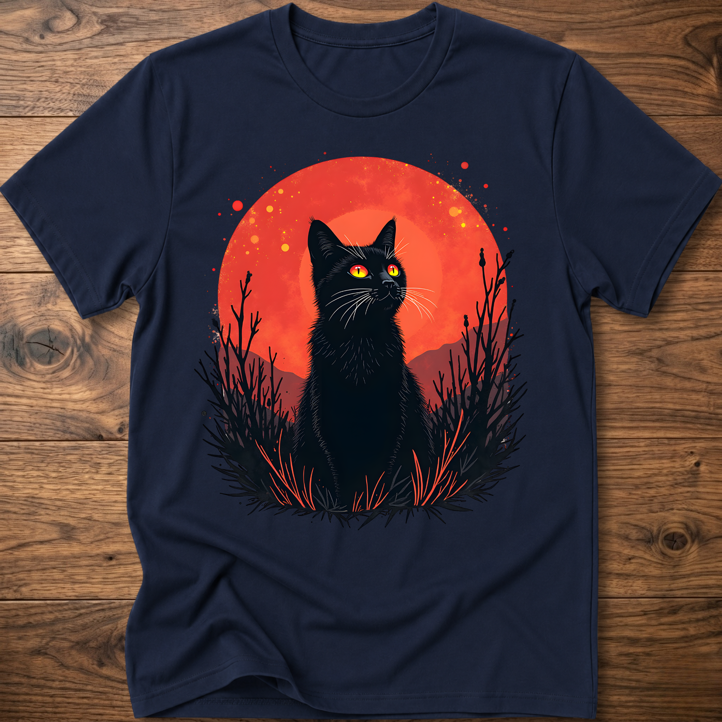 Navy T-shirt with black cat graphic in red-orange halo and night-plant silhouettes