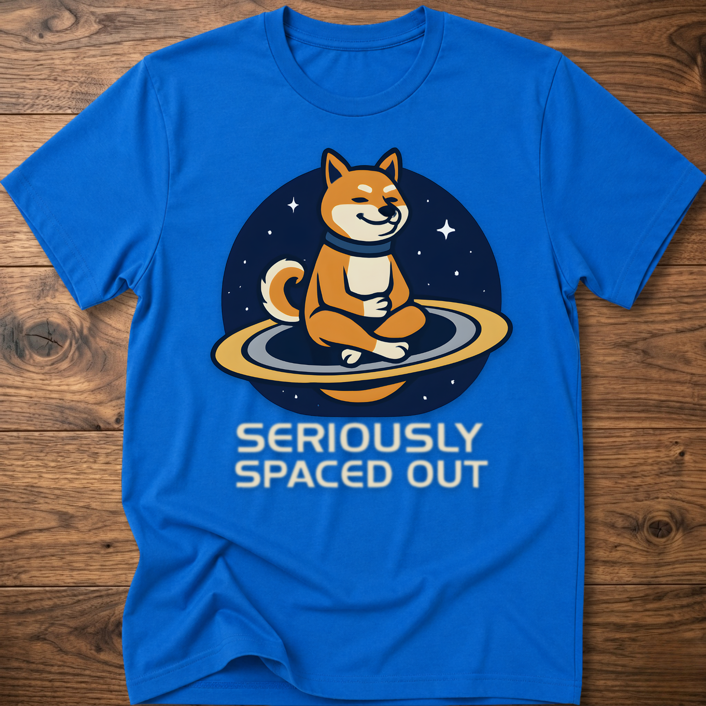 Royal blue dog astronaut graphic t-shirt with "SERIOUSLY SPACED OUT" text