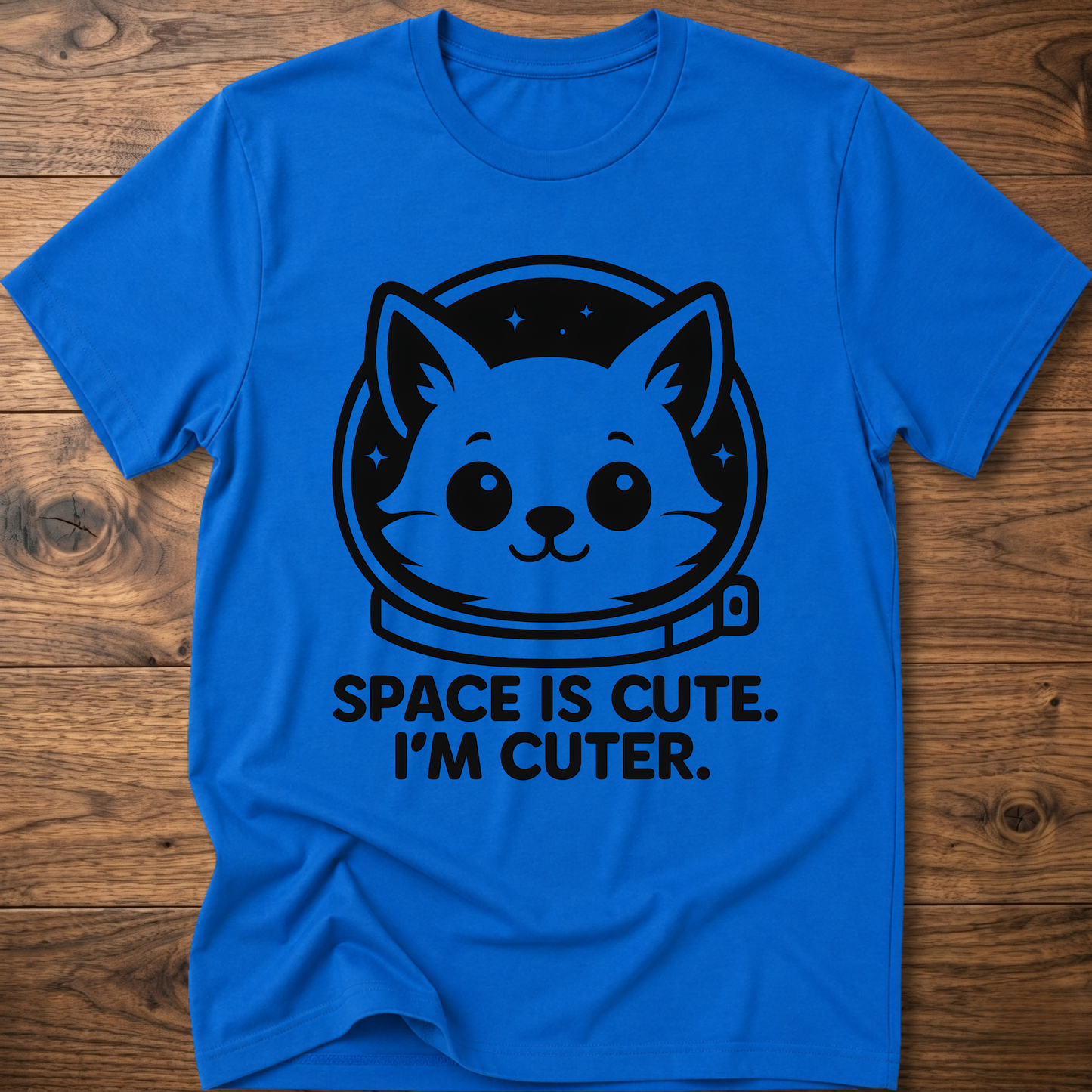 Royal blue T-shirt with space cat face graphic and text "SPACE IS CUTE. I'M CUTER."