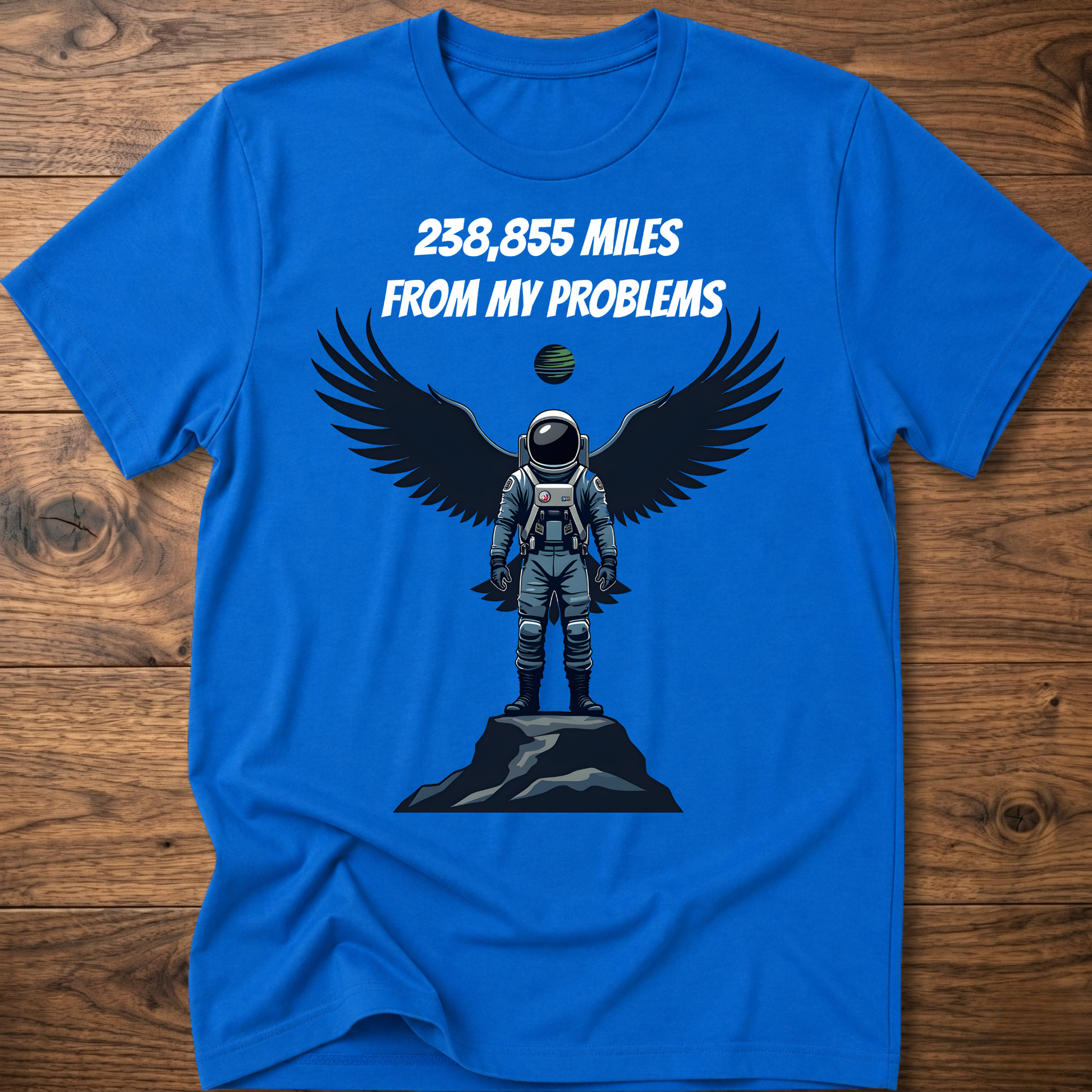 Royal blue crewneck t-shirt with astronaut-eagle graphic and text '238,855 Miles'.