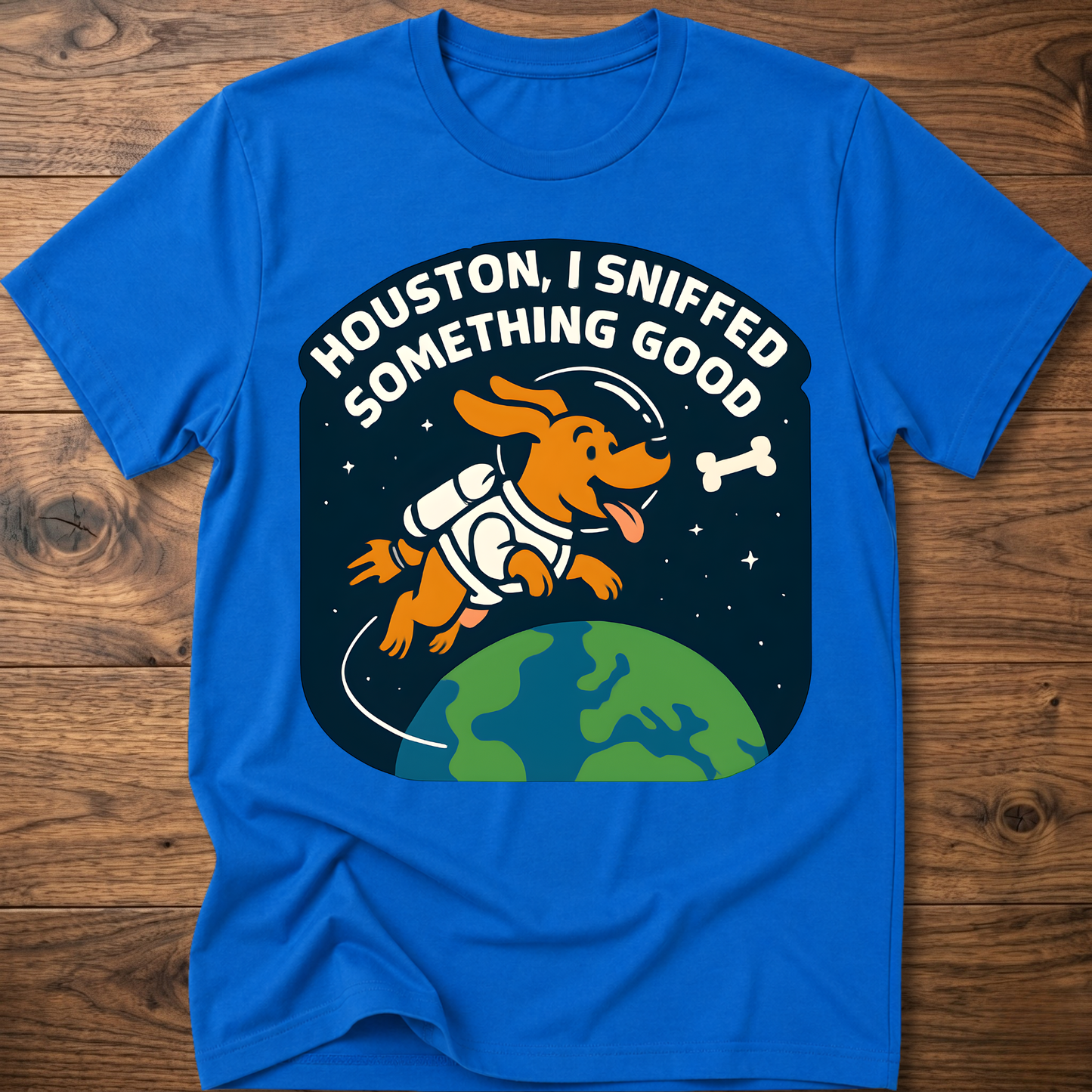 Royal blue dog-themed graphic T-shirt with bone and earth illustration