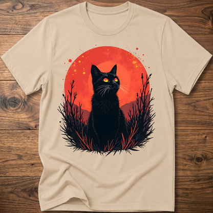 Beige T-shirt with black cat graphic in red-orange halo and night-plant silhouettes