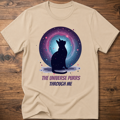 Sand beige cat t-shirt with cosmic cat silhouette and purple "The universe purrs through me" text
