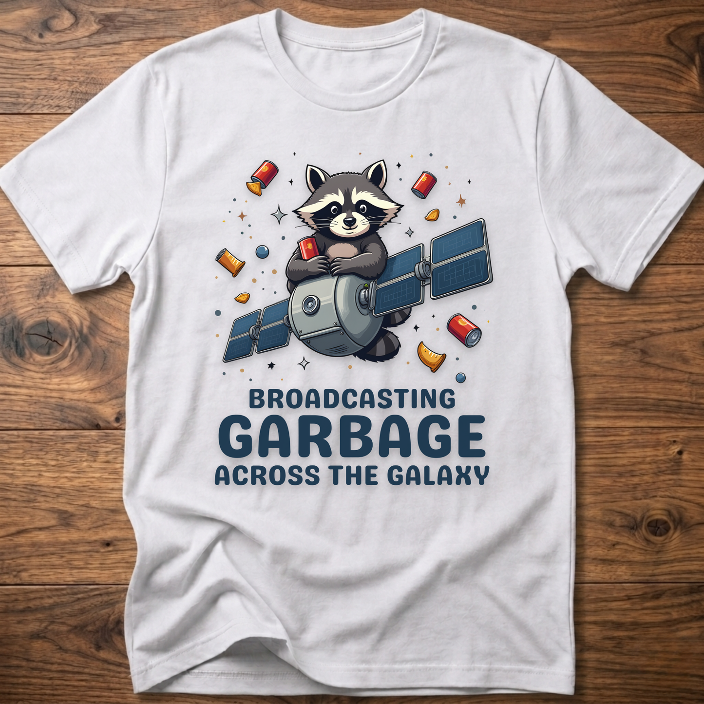 White crew-neck T-shirt with raccoon holding megaphone graphic and “Broadcasting Garbage” text.