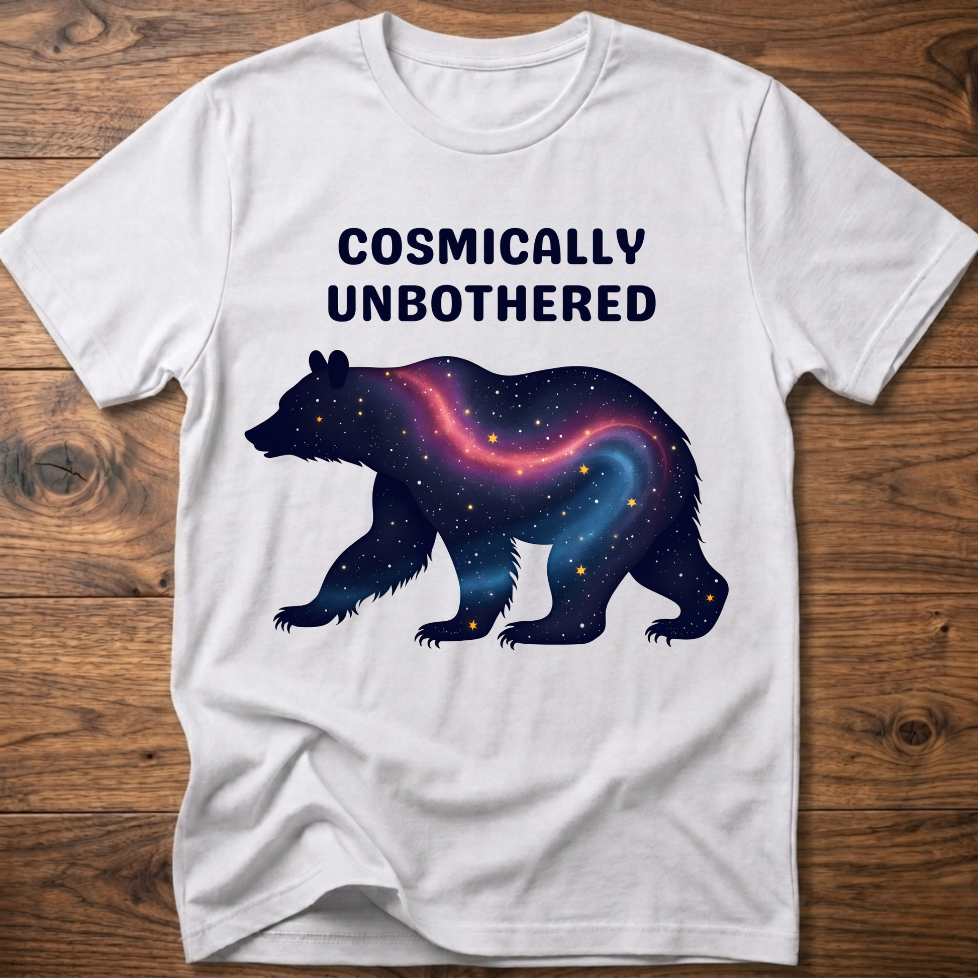 White graphic t-shirt with cosmic bear and COSMICALLY UNBOTHERED lettering